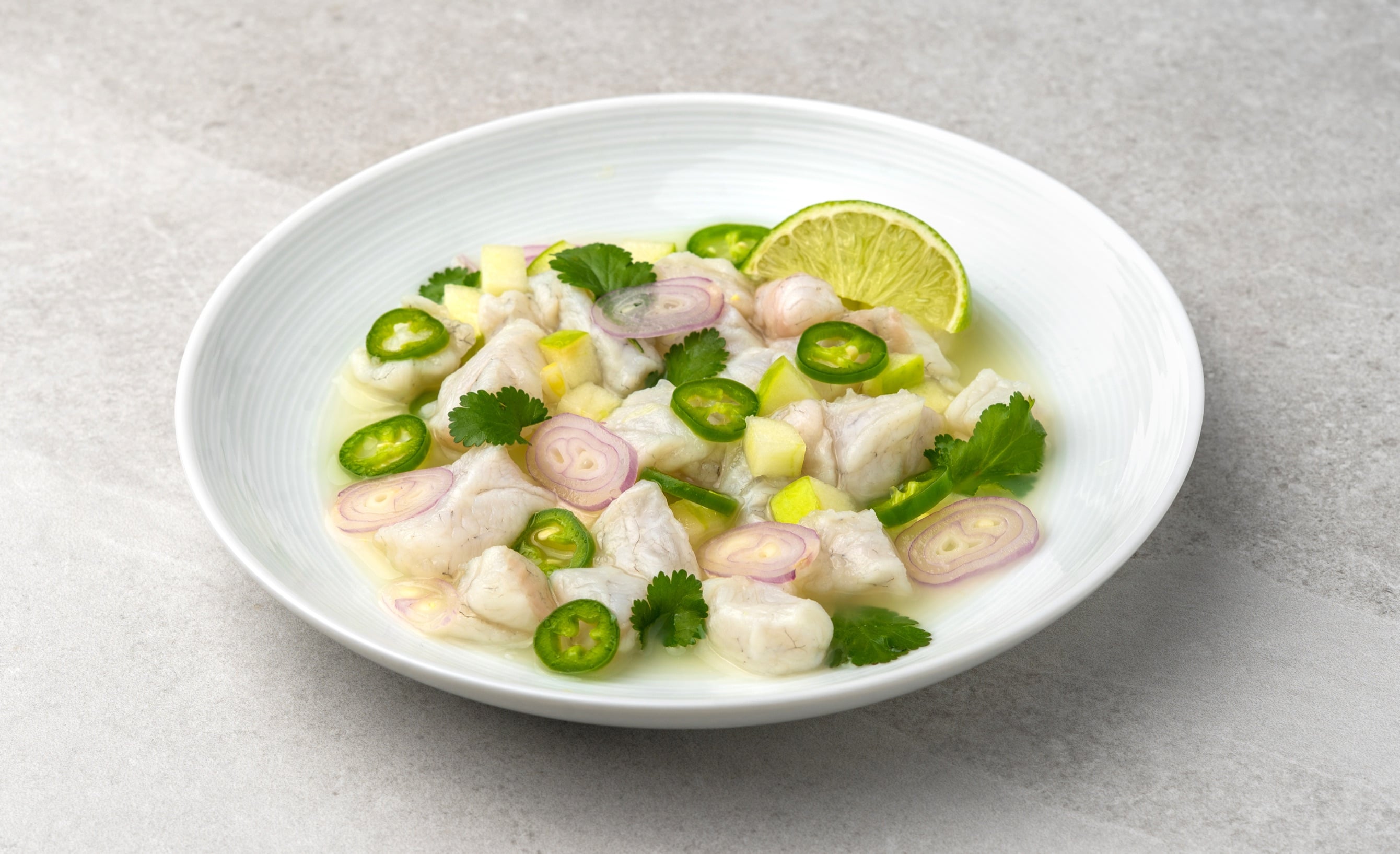 Grouper ceviche with lime, jalapeño rings, shallots and cilantro