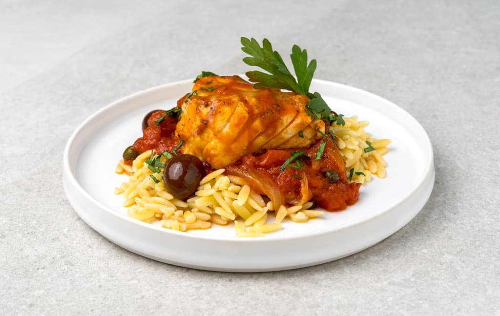 Fish in tomato sauce with orzo