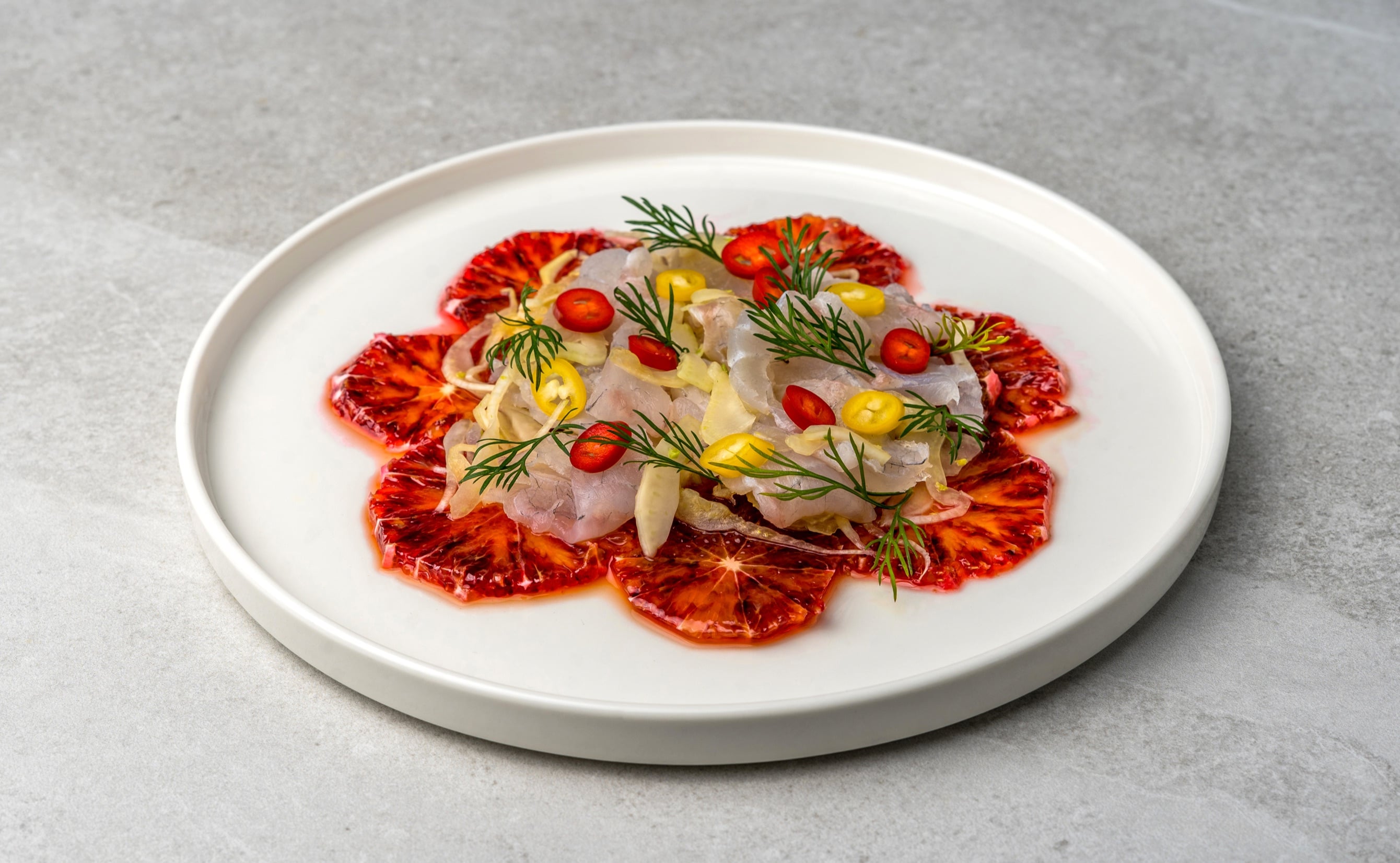 Grouper crudo on blood orange slices with marinated fennel and dill